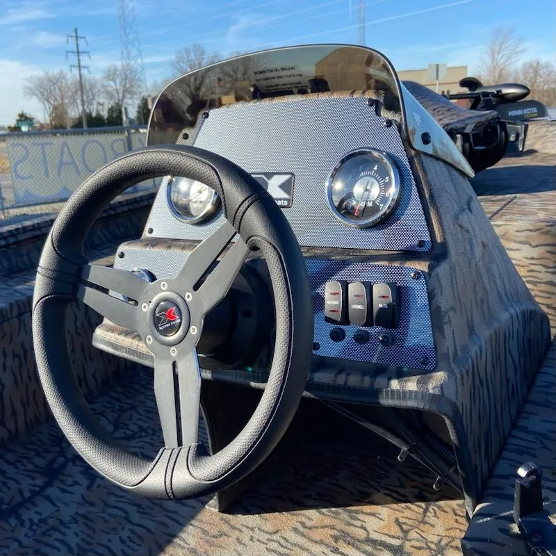Slide: The Image of 2024 Xpress XP180 boat dashboard with steering wheel and gauges in sunlight. - 6