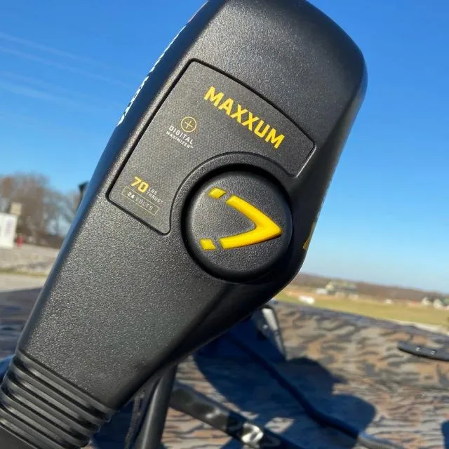 Slide: The Image of Close-up of Maxxum motor control on 2024 Xpress XP180 boat, outdoors. - 9