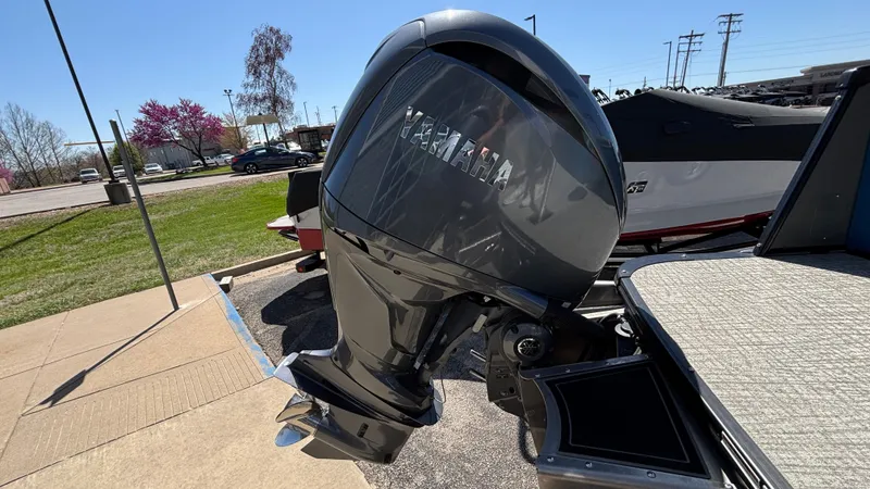 Slide: The Image of 2024 Tahoe Pontoon 2585 Cascade with Yamaha outboard motor in a parking lot. - 11