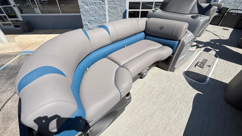 Slide: The Image of 2024 Tahoe Pontoon 2585 Cascade with gray and blue seating, showcasing luxury and comfort. - 17