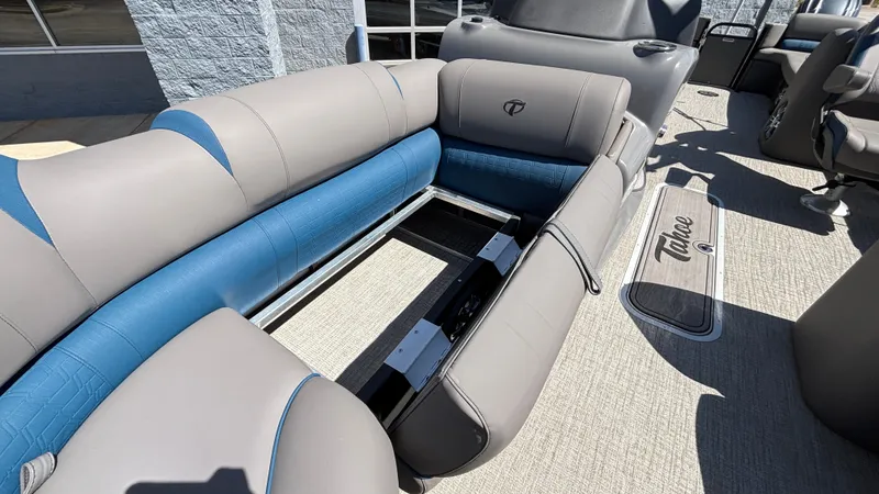 Slide: The Image of 2024 Tahoe Pontoon 2585 Cascade interior with gray and blue seating, showcasing luxury design. - 19