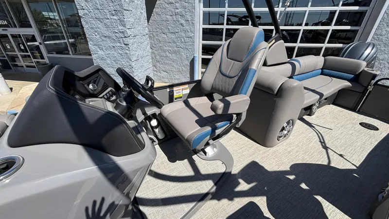 Slide: The Image of 2024 Tahoe Pontoon 2585 Cascade interior with modern seating and steering console. - 24