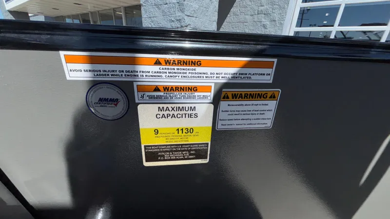 Slide: The Image of 2024 Tahoe Pontoon 2585 Cascade warning labels and maximum capacity information. - 43