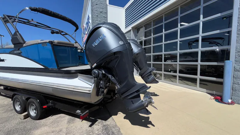 Slide: The Image of 2024 Tahoe Pontoon 2585 Cascade with dual Yamaha outboard motors on a trailer. - 49