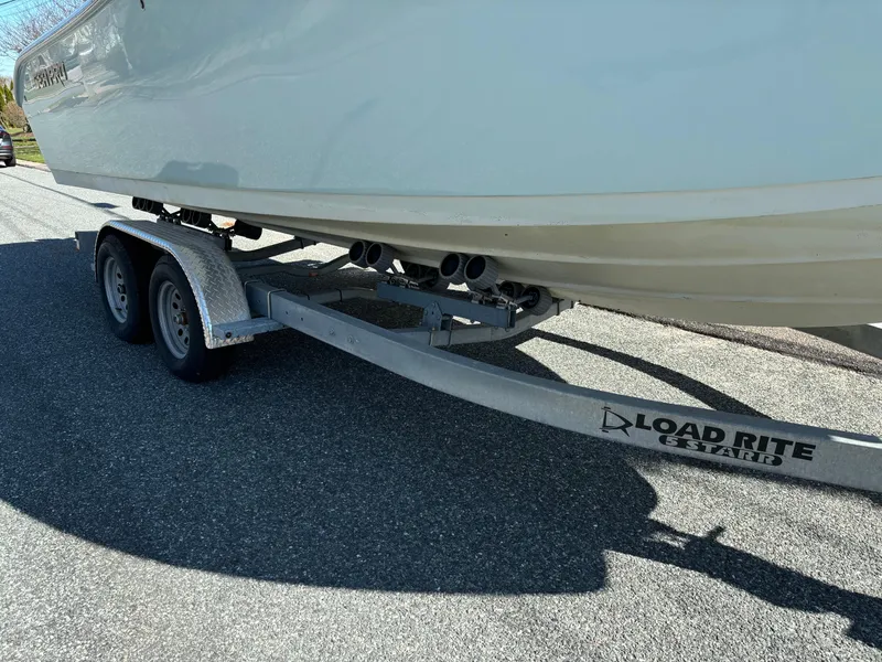 Slide: The Image of 2022 Sea Pro 239 Center Console boat on Load Rite trailer, parked on asphalt. - 7