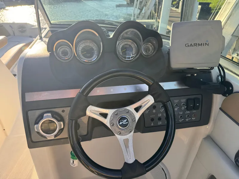 Slide: The Image of Steering wheel and dashboard of 2011 Sea Ray 280 Sundeck with Garmin navigation system. - 7