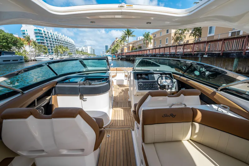 Slide: The Image of Luxurious 2015 Sea Ray 350 SLX boat interior with plush seating and modern dashboard. - 29