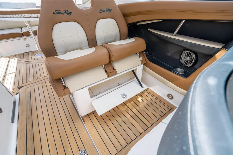 Slide: The Image of 2015 Sea Ray 350 SLX boat interior with teak flooring and leather seating. - 32