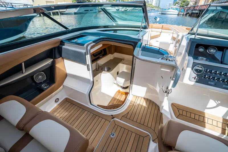 Slide: The Image of 2015 Sea Ray 350 SLX boat interior with luxurious seating and modern dashboard. - 36