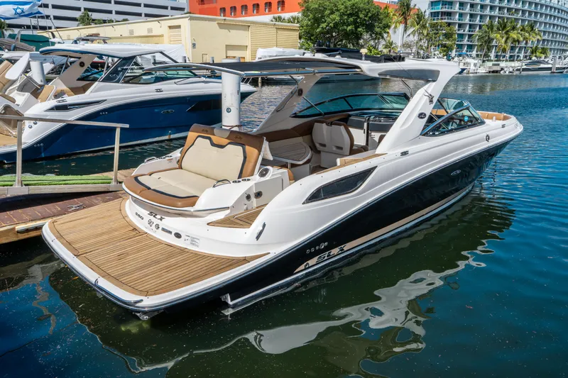 Slide: The Image of 2015 Sea Ray 350 SLX luxury boat docked in a marina. - 4