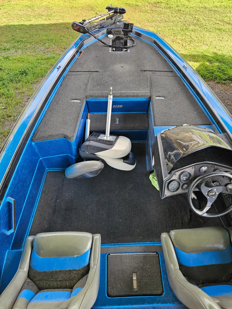 Slide: The Image of 1993 Bullet 20XD boat interior with blue accents and steering console. - 12