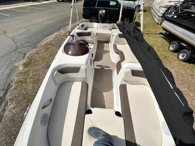 Slide: The Image of 2023 Bayliner Element 18 Deck Boat interior with spacious seating and modern design. - 5