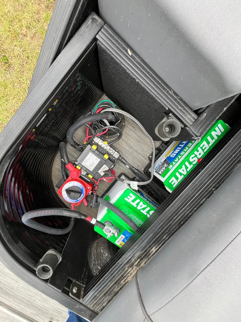 Slide: The Image of Battery compartment of 2022 Bennington LXS SPORT 24 LXSB with Interstate battery. - 10