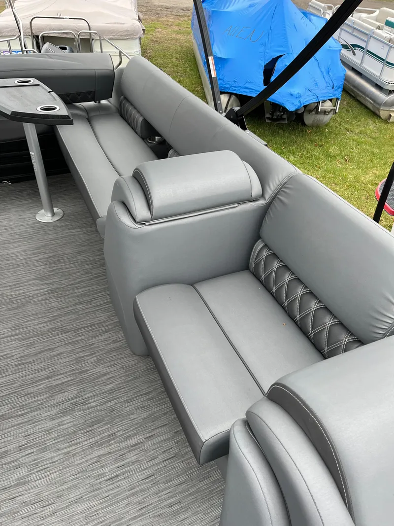 Slide: The Image of Luxurious seating on 2022 Bennington LXS SPORT 24 LXSB pontoon boat, featuring gray upholstery. - 14