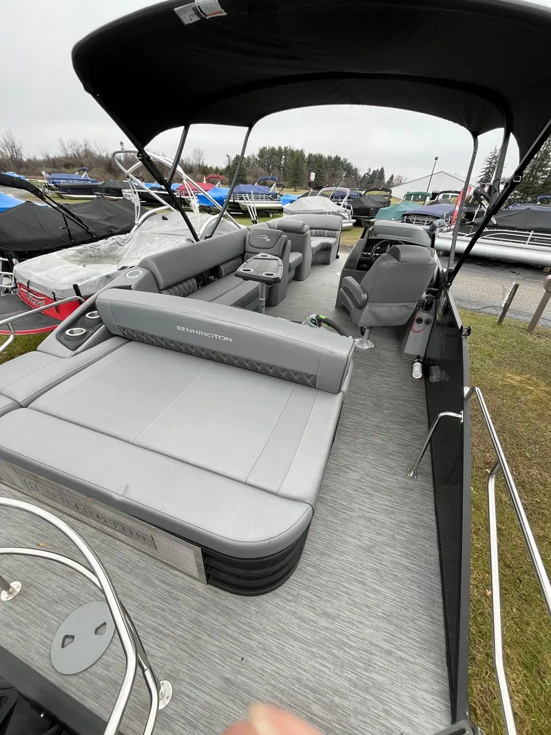 Slide: The Image of 2022 Bennington LXS SPORT 24 LXSB pontoon boat with spacious seating and canopy. - 7