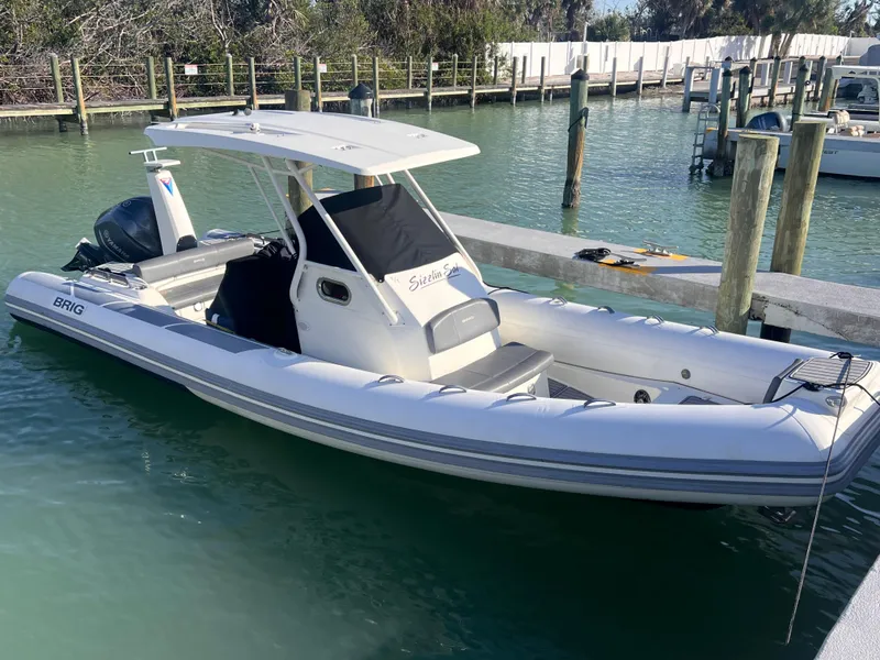 Slide: The Image of 2022 Brig Eagle 8 boat docked in a marina, featuring sleek design and modern amenities. - 12