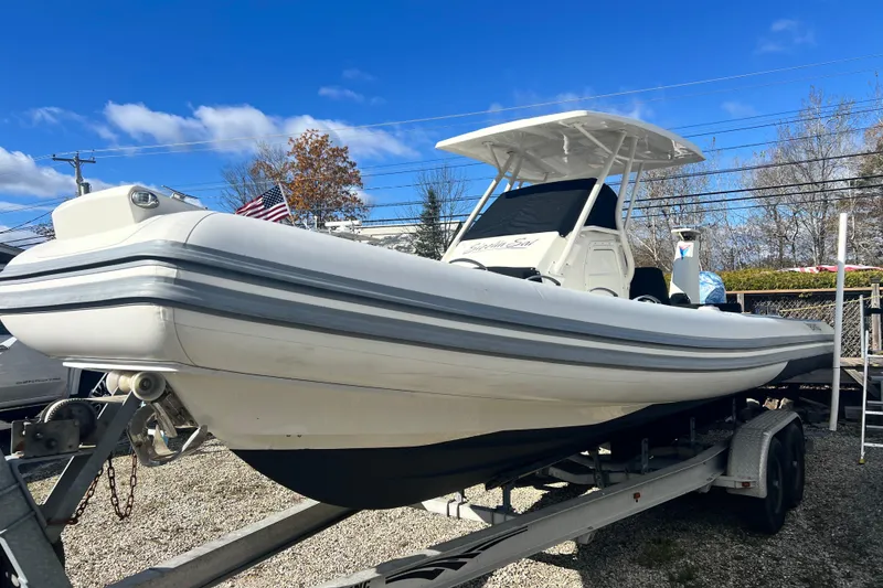 Slide: The Image of 2022 Brig Eagle 8 boat on trailer under clear blue sky. - 40
