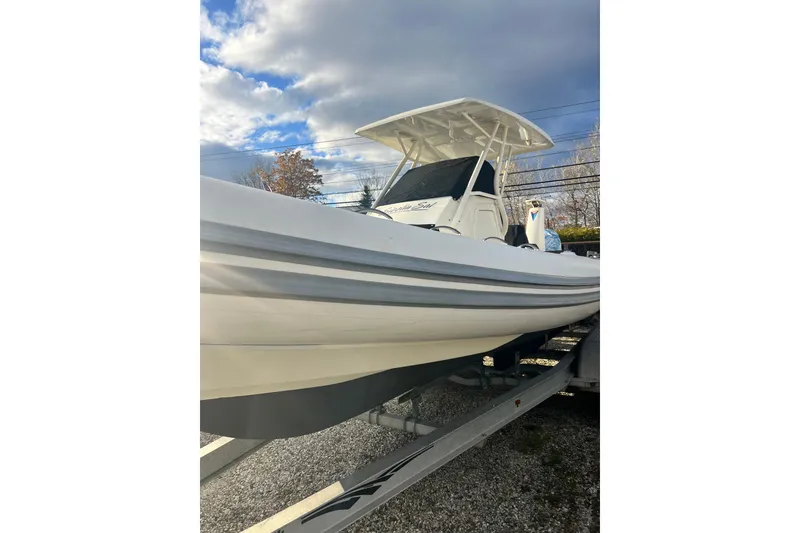 Slide: The Image of 2022 Brig Eagle 8 boat on trailer under cloudy sky. - 41