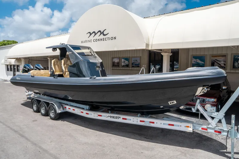 Slide: The Image of 2023 Ribco Seafarer 36 X boat on trailer at Marine Connection dealership. - 1