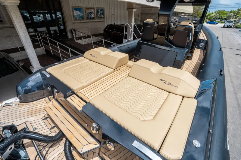 Slide: The Image of 2023 Ribco Seafarer 36 X luxury boat with tan seating and sleek design. - 11
