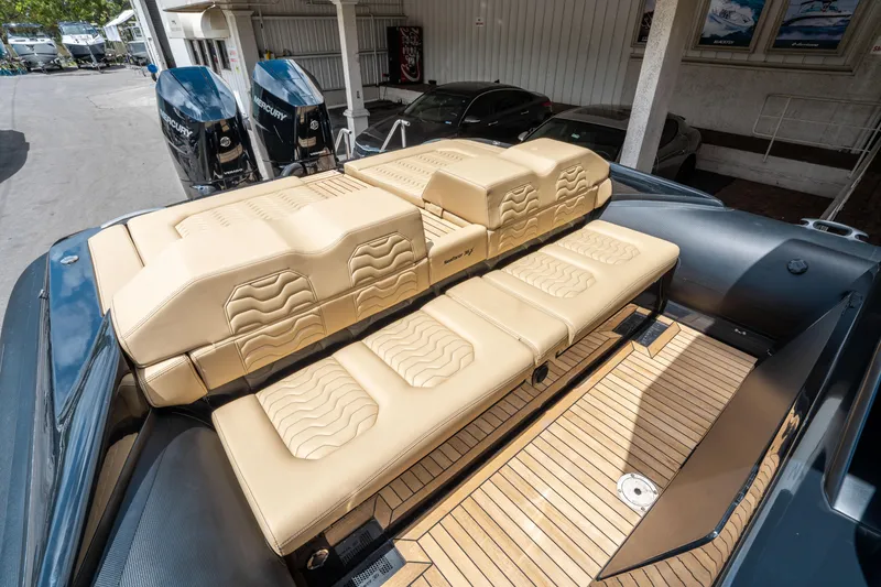 Slide: The Image of 2023 Ribco Seafarer 36 X boat with beige leather seating and teak deck. - 16