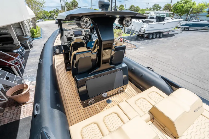 Slide: The Image of 2023 Ribco Seafarer 36 X boat interior with modern helm and seating. - 21