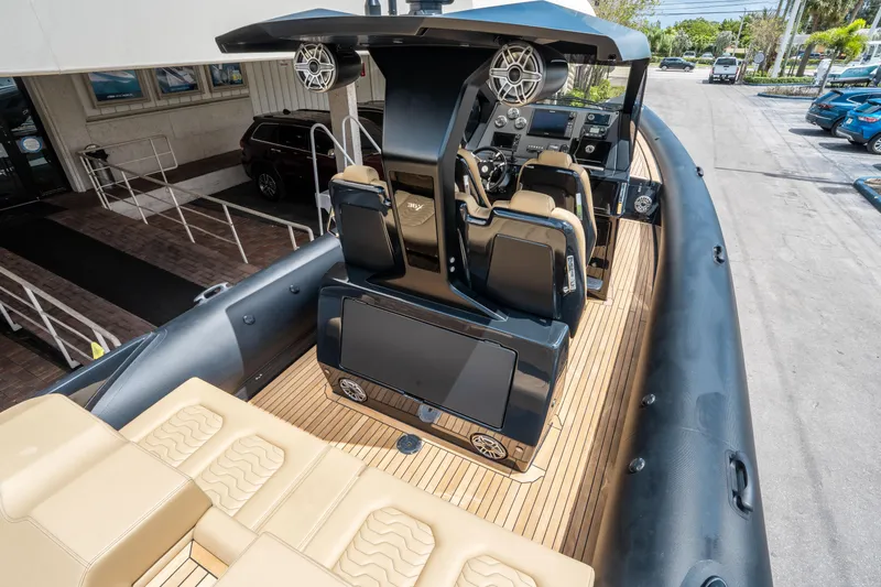 Slide: The Image of 2023 Ribco Seafarer 36 X boat interior with modern seating and control panel. - 22