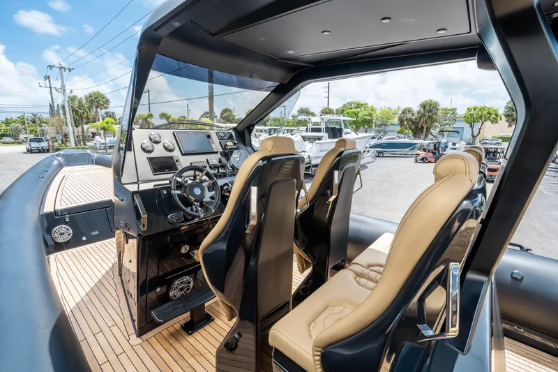Slide: The Image of 2023 Ribco Seafarer 36 X boat interior with modern dashboard and luxurious seating. - 25