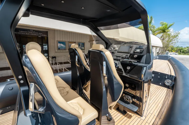 Slide: The Image of 2023 Ribco Seafarer 36 X interior with modern dashboard and beige seating. - 26
