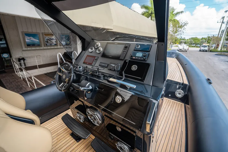 Slide: The Image of 2023 Ribco Seafarer 36 X boat dashboard with modern controls and sleek design. - 37