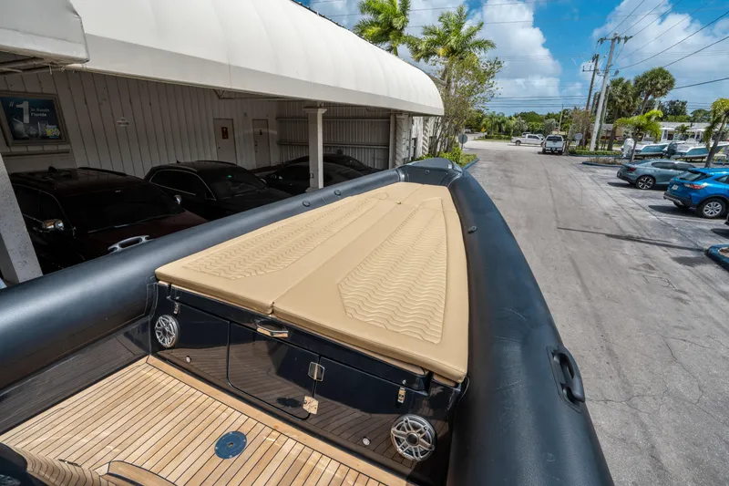 Slide: The Image of 2023 Ribco Seafarer 36 X boat with tan deck, parked outdoors. - 45