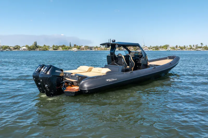 Slide: The Image of 2023 Ribco Seafarer 36 X boat on calm water, featuring sleek design and powerful engines. - 7