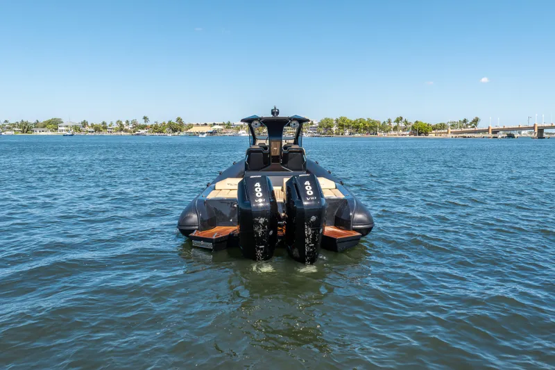 Slide: The Image of 2023 Ribco Seafarer 36 X boat on water, rear view with dual engines. - 8