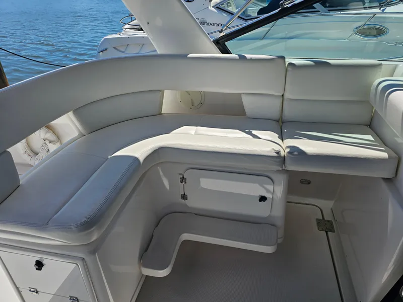 Slide: The Image of 2000 Tiara Yachts 3100 Open interior with white seating and ocean view. - 13