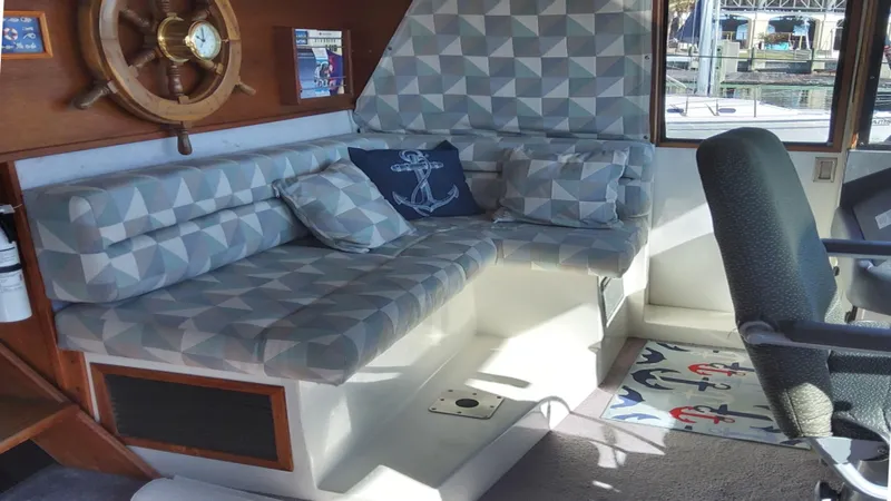 Slide: The Image of Interior of 1991 Bayliner 4588 Motoryacht with geometric-patterned seating and nautical decor. - 3