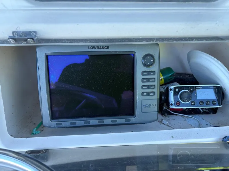 Slide: The Image of Lowrance HDS-10 marine GPS system on 2003 Grady-White Advance 257 boat dashboard. - 3