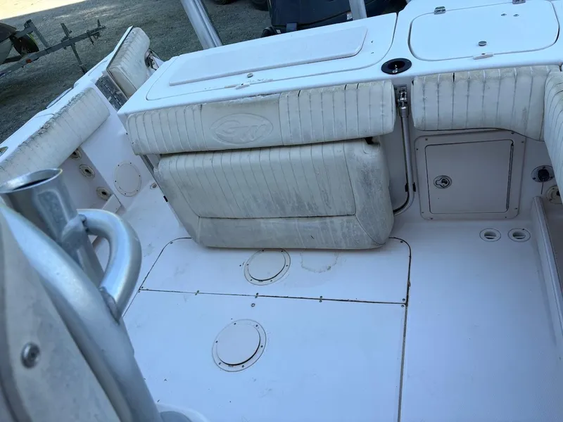 Slide: The Image of 2003 Grady-White Advance 257 boat interior with seating and storage compartments. - 4