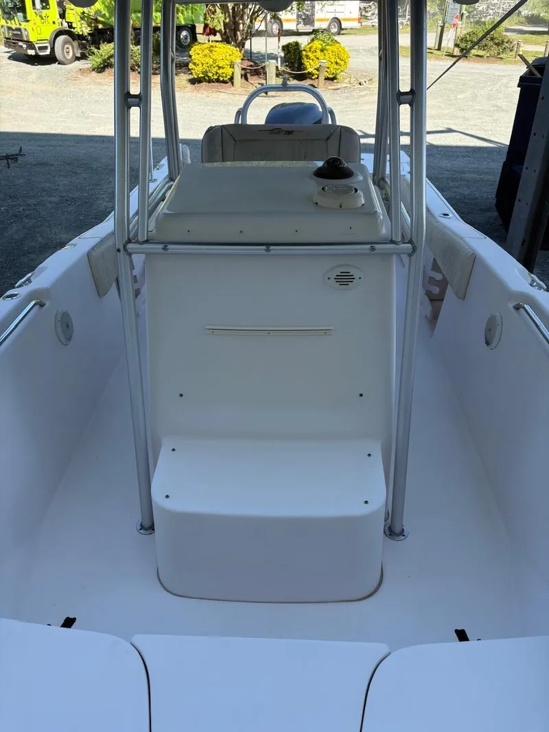 Slide: The Image of 2003 Grady-White Advance 257 boat interior, featuring a clean, spacious deck and seating area. - 7