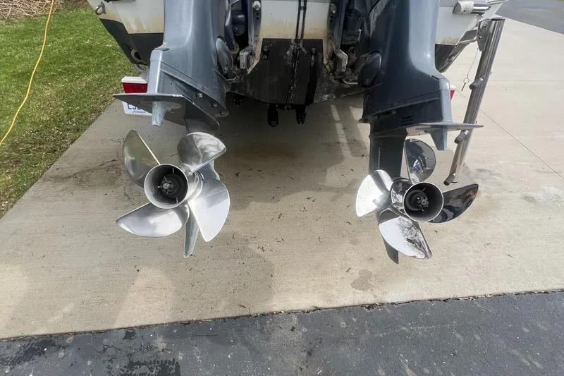 Slide: The Image of 2006 Polar 2300 Walkaround boat with dual propellers on a concrete driveway. - 3