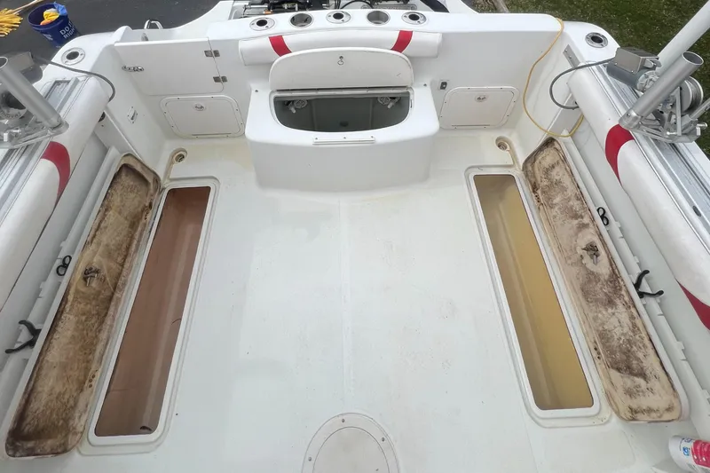 Slide: The Image of 2006 Polar 2300 Walkaround boat interior with storage compartments and seating. - 6