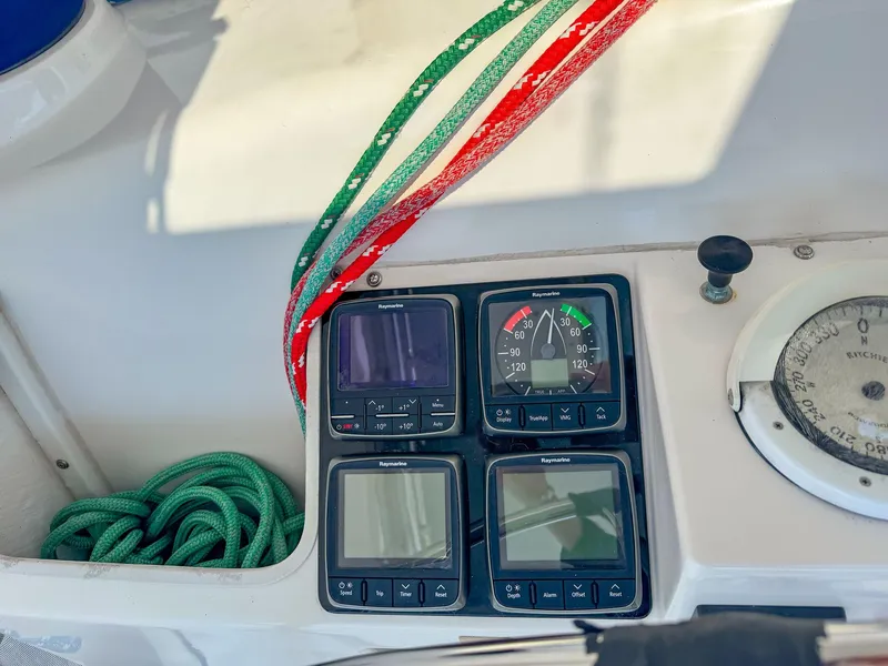 Slide: The Image of Control panel of a 2000 Manta 42 sailboat with ropes and gauges. - 12