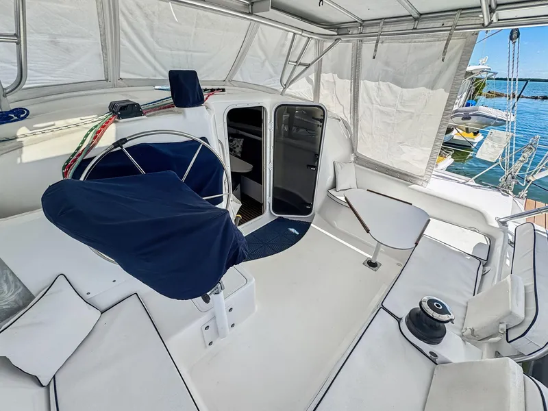 Slide: The Image of Cockpit of 2000 Manta 42 sailboat with covered helm and seating area. - 17