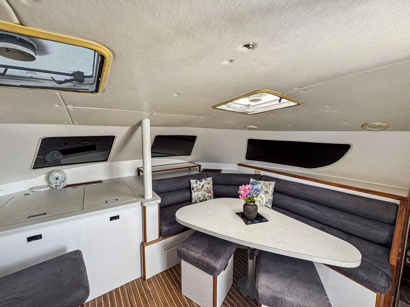 Slide: The Image of Interior of 2000 Manta 42 yacht with dining area and modern seating. - 19
