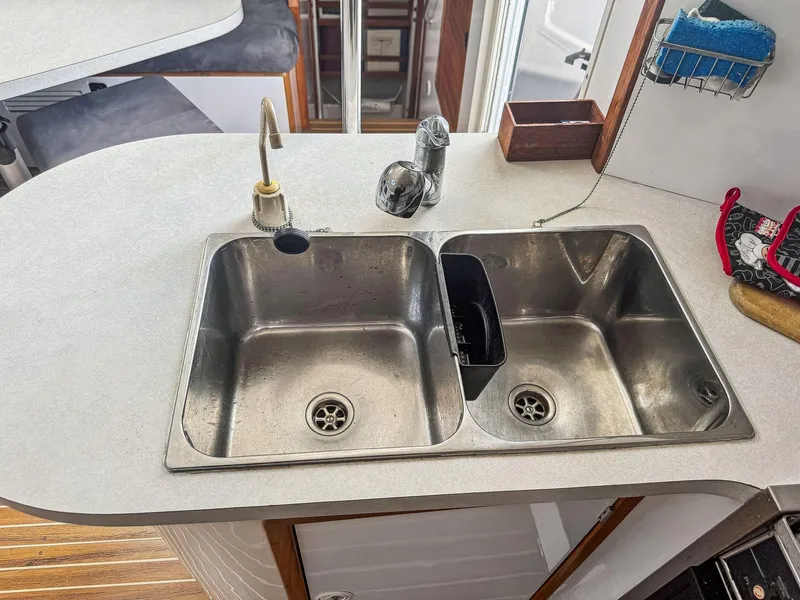 Slide: The Image of Double sink in a 2000 Manta 42 yacht kitchen with modern fixtures. - 30