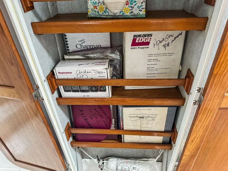 Slide: The Image of Cabinet with books and manuals on a Manta 42, year 2000. - 42