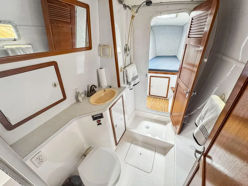 Slide: The Image of Bathroom interior of 2000 Manta 42 yacht with shower, sink, and toilet. - 47