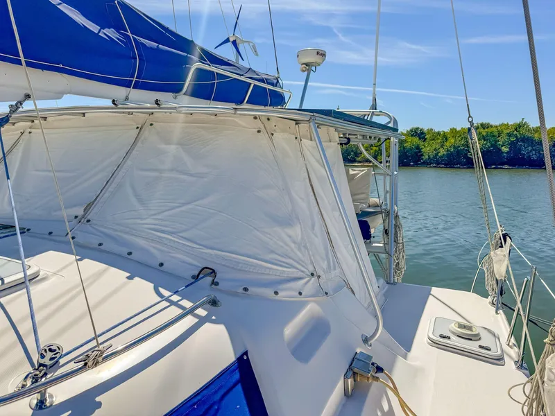 Slide: The Image of Sailing yacht Manta 42, 2000 model, on calm waters under clear blue skies. - 5