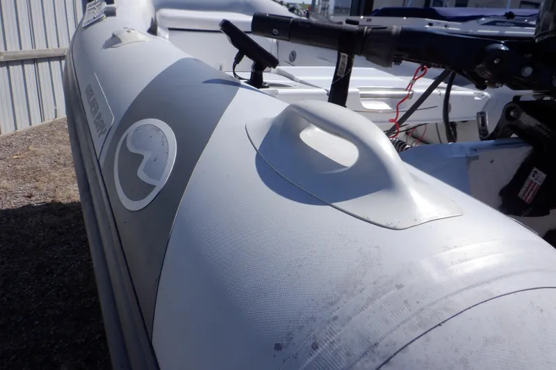 Slide: The Image of Walker Bay Odyssey 325 ST inflatable boat, 2015 model, close-up of side handle and logo. - 21