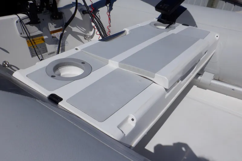 Slide: The Image of Walker Bay Odyssey 325 ST 2015 boat console with cup holders and control panel. - 26