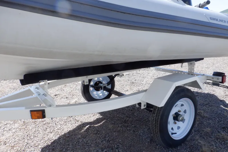 Slide: The Image of Walker Bay Odyssey 325 ST boat on trailer, 2015 model, side view. - 40